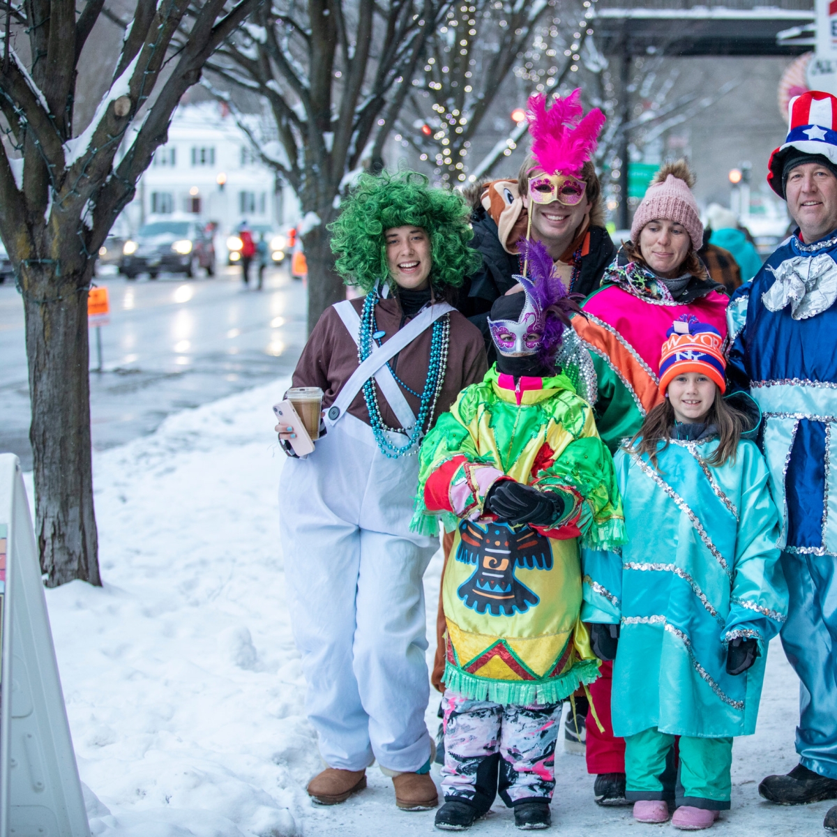 Family posing during Mardi Gras in Ellicottville