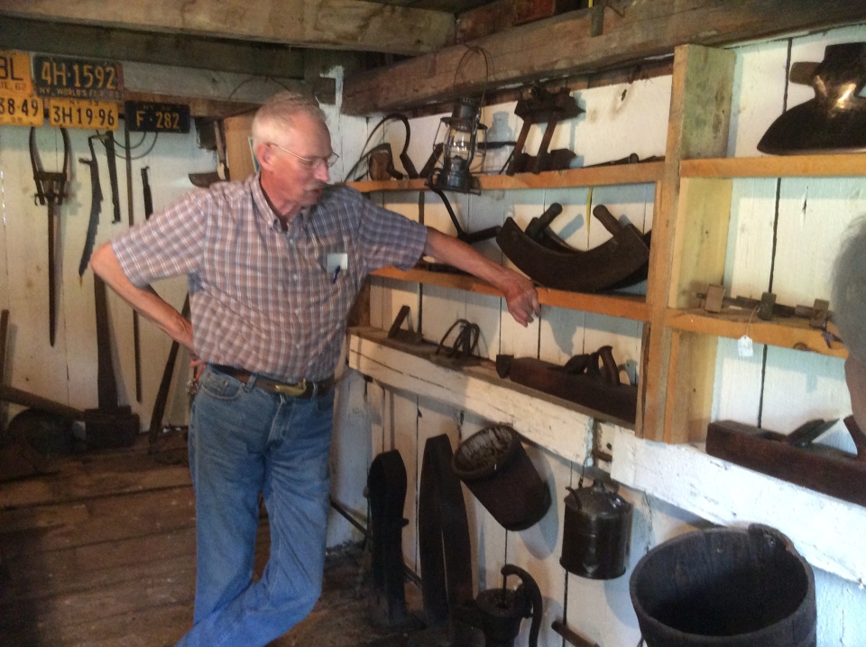 Guy showcasing historic material at Ruth Howe-Prescott House