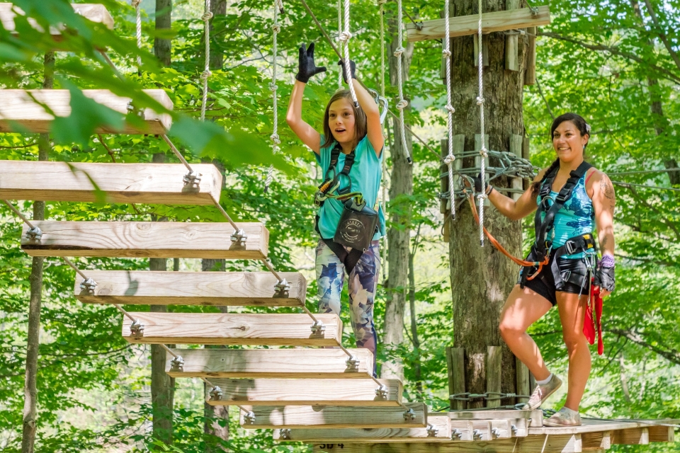 Mom and daughter obstacle course in trees at Sky High Adventure Park