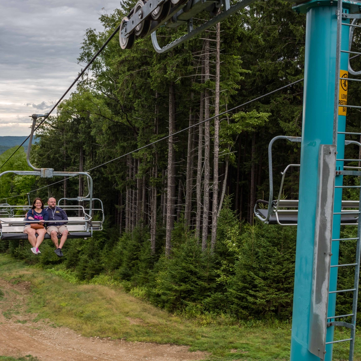 Couple on a Summer Chairlift ride on Spruce lift at Holiday Valley Resort