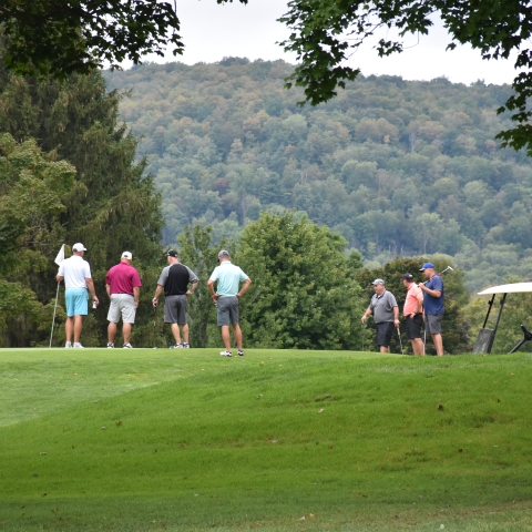 Golfers on the course at Elkdale Country Club