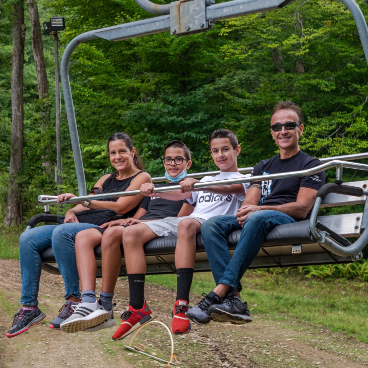 Family on a summer chairlift ride at Holiday Valley Resort