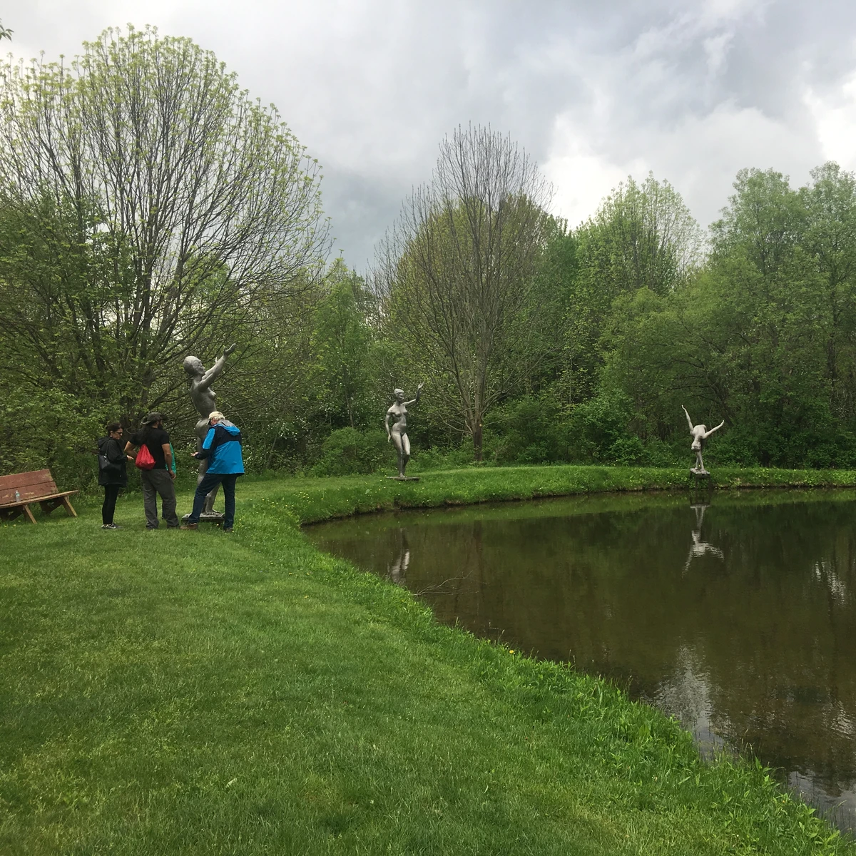 Tour at Griffis Sculpture Park, sculptures around a pond