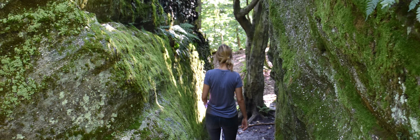 Hiker going through the rocks at Little Rock City