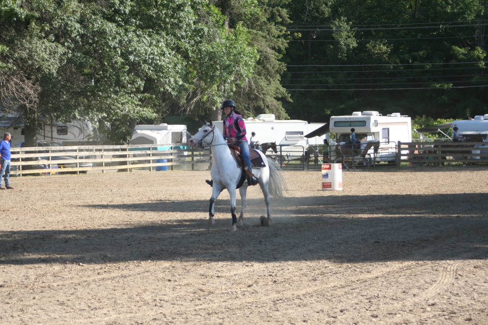 Girl riding horse at fairgound