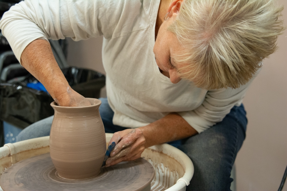 Woman making pottery at Tri-County Arts Council