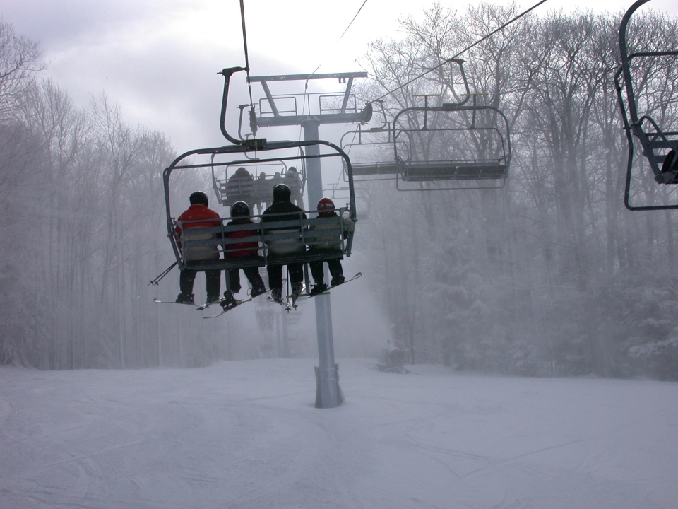 Group riding up the chairlift at HoliMont