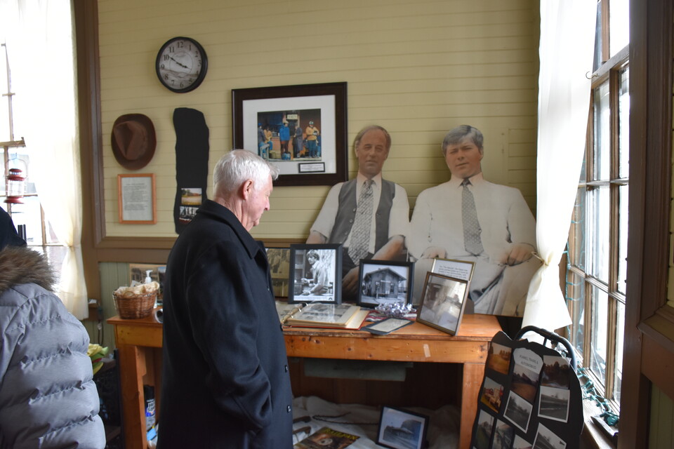 Man looking at exhibit at the Depot Movie & Rail Museum in South Dayton