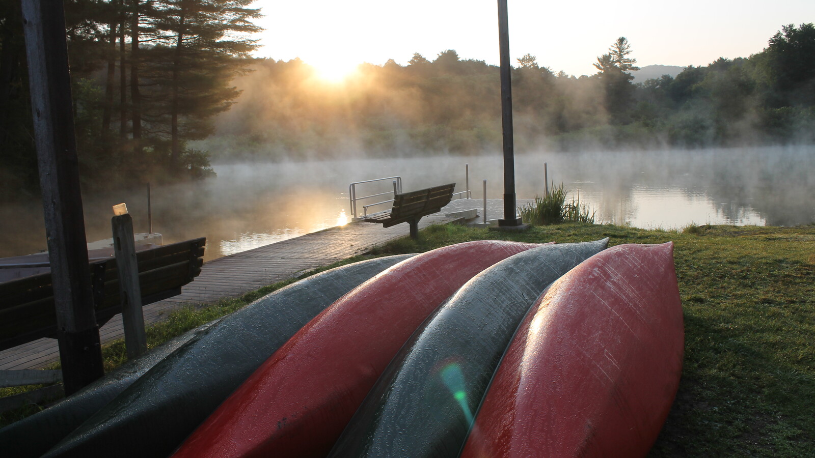 Canoes in rest on the shores of Red House Lake