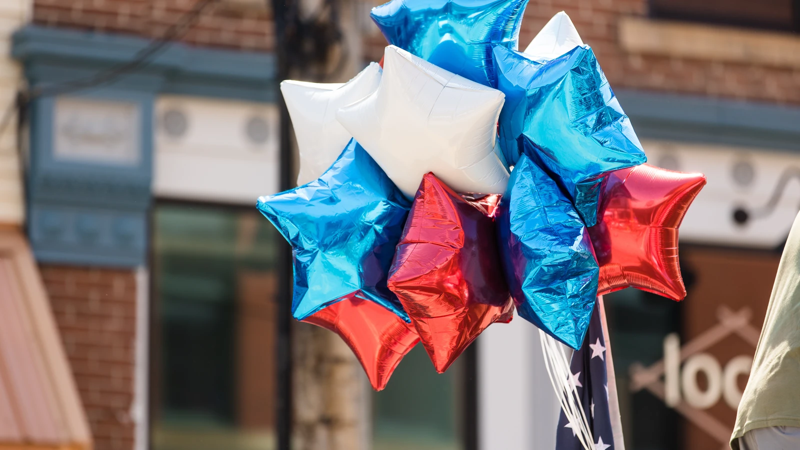 Red, white and blue balloons in a parade