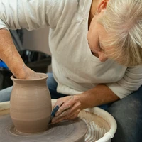 Woman making pottery at Tri-County Arts Council