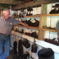 Guy showcasing historic material at Ruth Howe-Prescott House