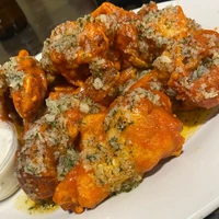 Hot Garlic Parm Chicken Wings from Hughes Hotel