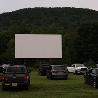 Cars parking at a drive-in to watch a movie
