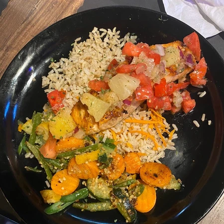 Salmon with pineapple salsa from Hometown Bar and Grill