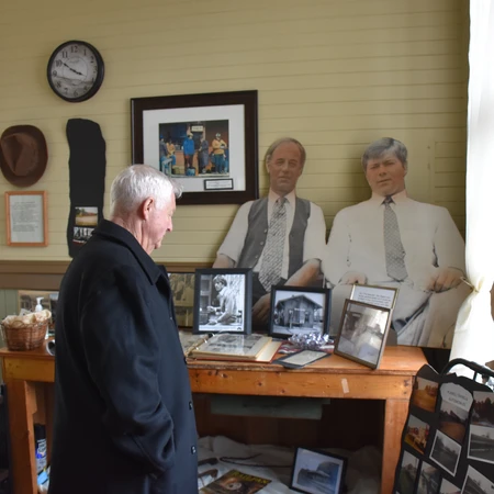 Man looking at exhibit at the Depot Movie & Rail Museum in South Dayton