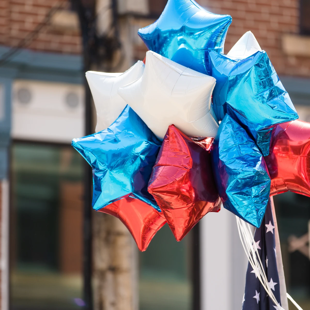 Red, white and blue balloons in a parade