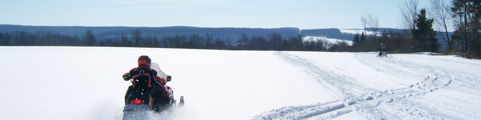 Snowmobiling through a field 