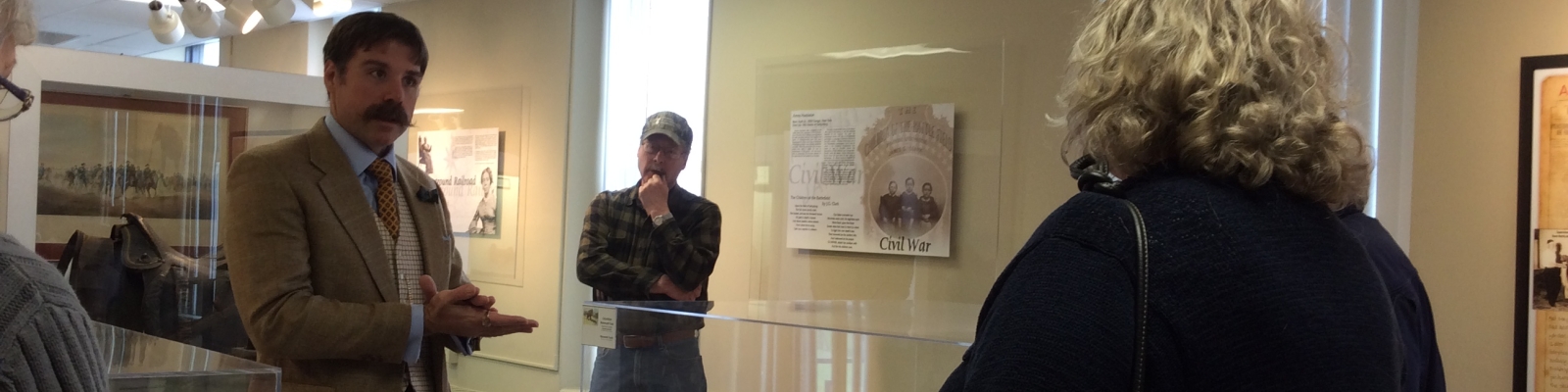 Visitors listening to Historian talk at Cattaraugus County Museum