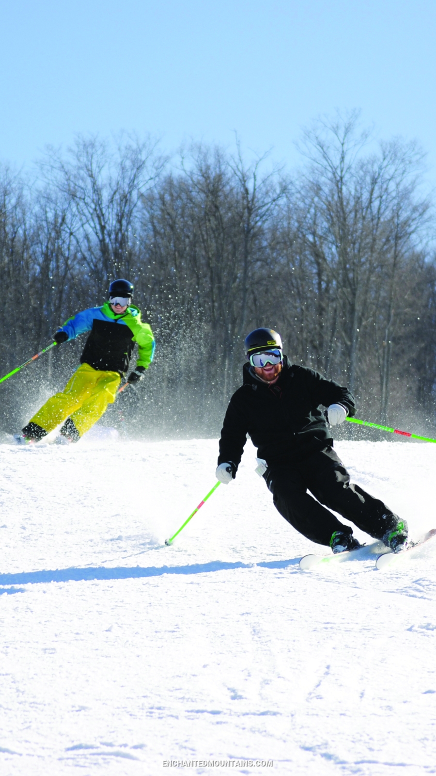 Skiers speeding downhill at HoliMont