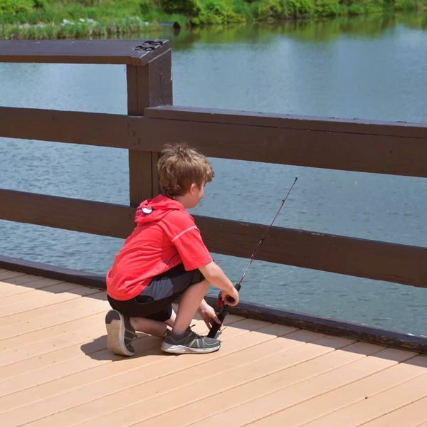 A kid fishing at Burch