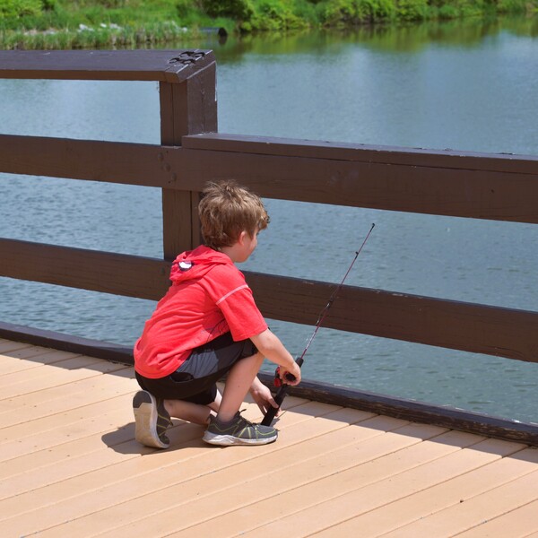 A kid fishing at Burch