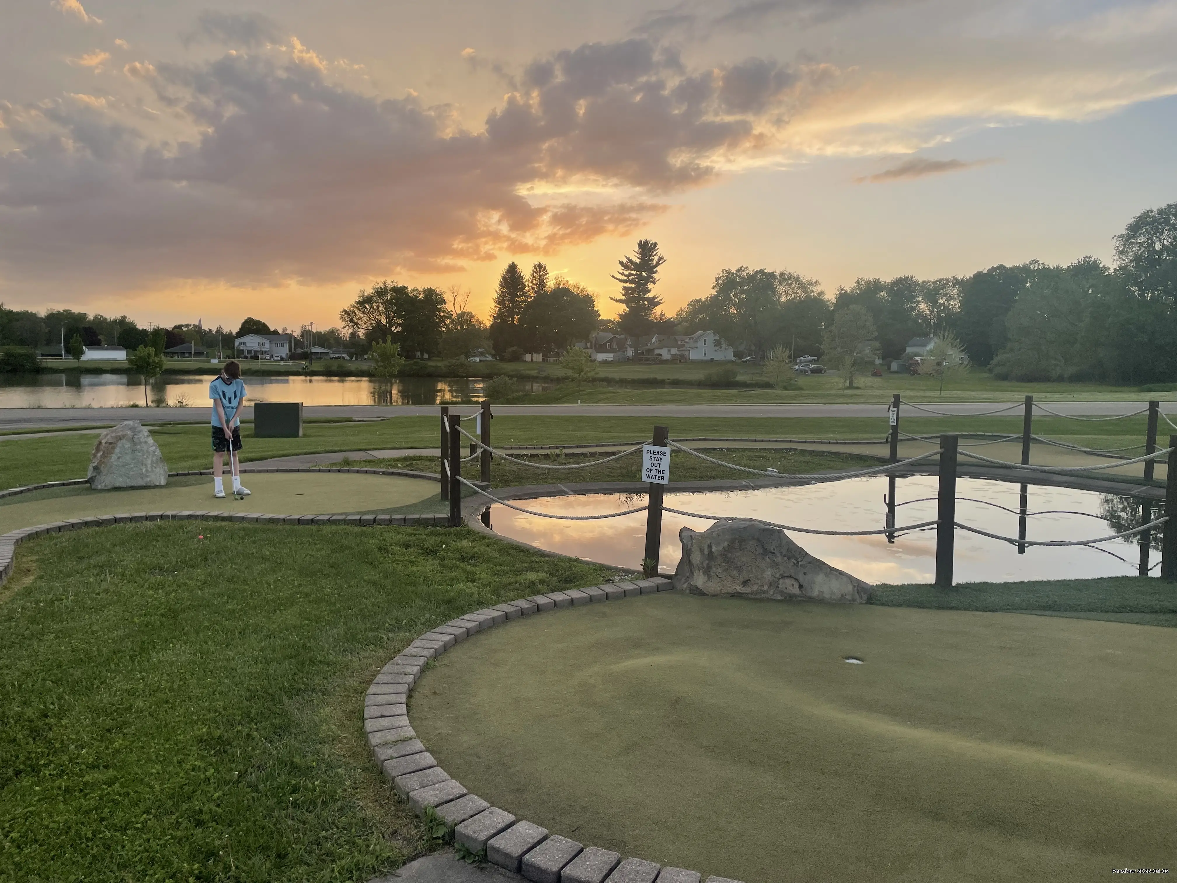 Boy playing putt putt at Good Times of Olean 