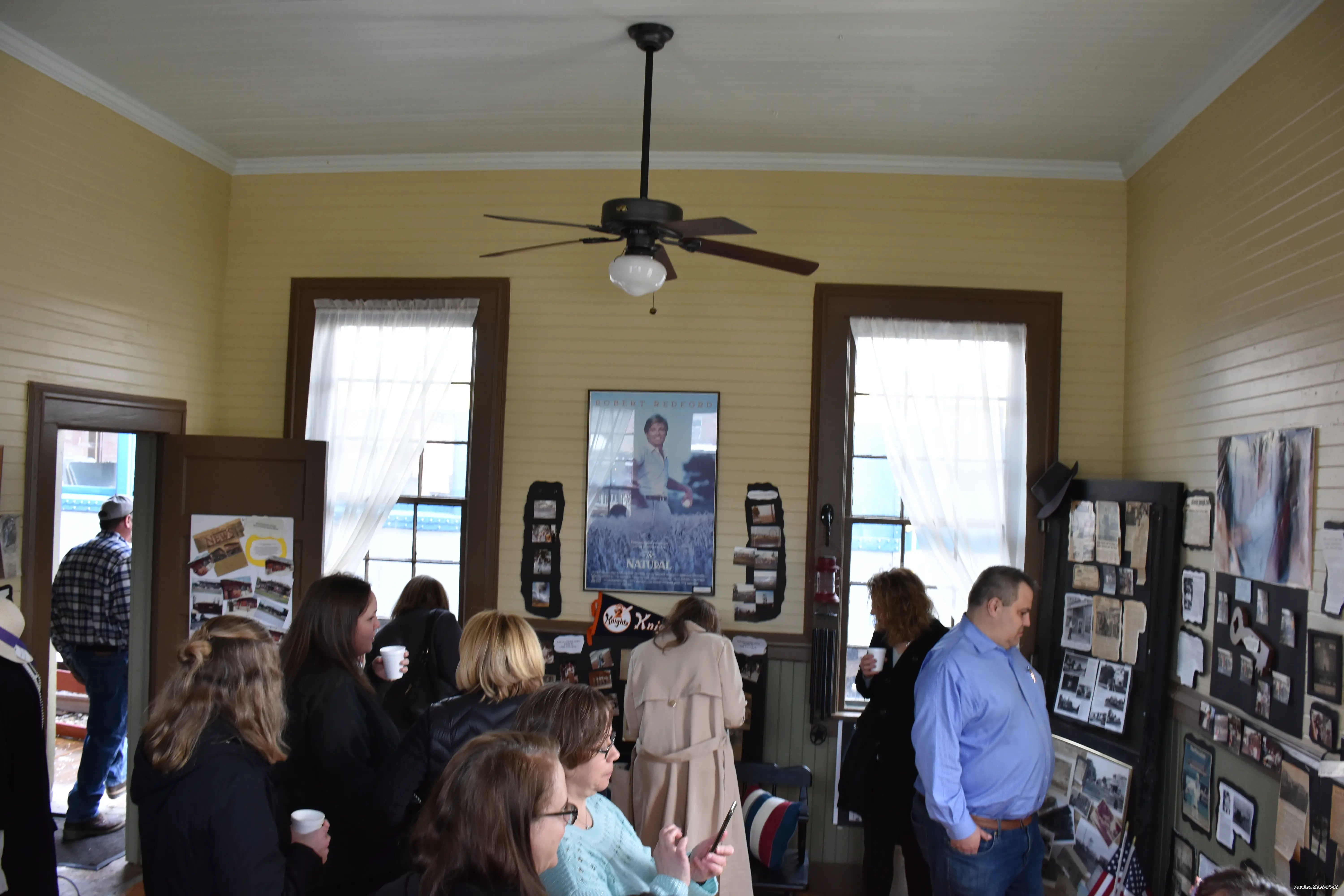 A crowd learning about history at the Depot Museum