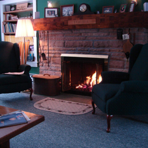 inside by the fireplace