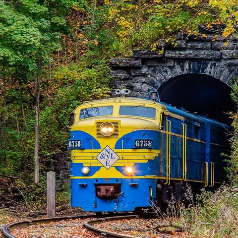 NYLE Train coming through the tunnel
