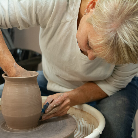 Woman making pottery at Tri-County Arts Council