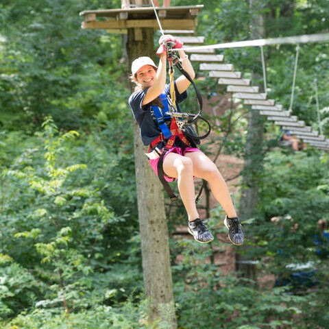 Person on a zipline at Sky High Adventure Park