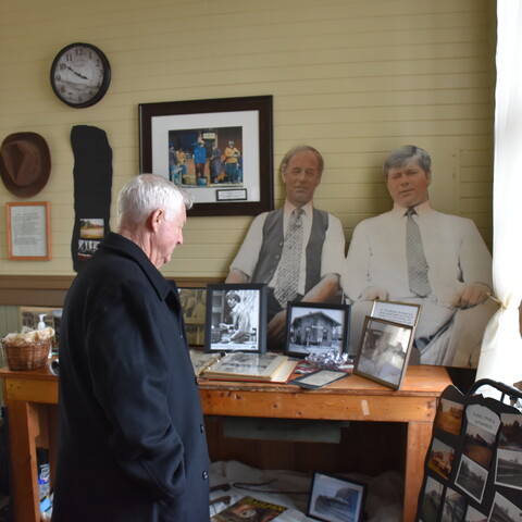 Man looking at exhibit at the Depot Movie & Rail Museum in South Dayton