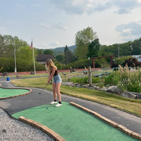 Girl playing putt putt at Mystic Water Resort in Limestone