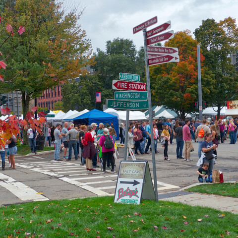 Street view from the north west of people and vendor tents at the 2018 Ellicottville Fall Festival