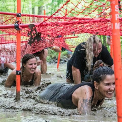 Crawling through a giant mud puddle at Holiday Valley's Mudslide