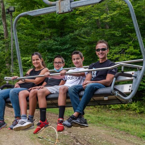 Family on a summer chairlift ride at Holiday Valley Resort