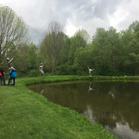 Tour at Griffis Sculpture Park, sculptures around a pond