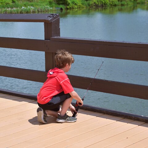 A kid fishing at Burch