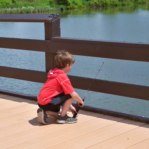 A kid fishing at Burch